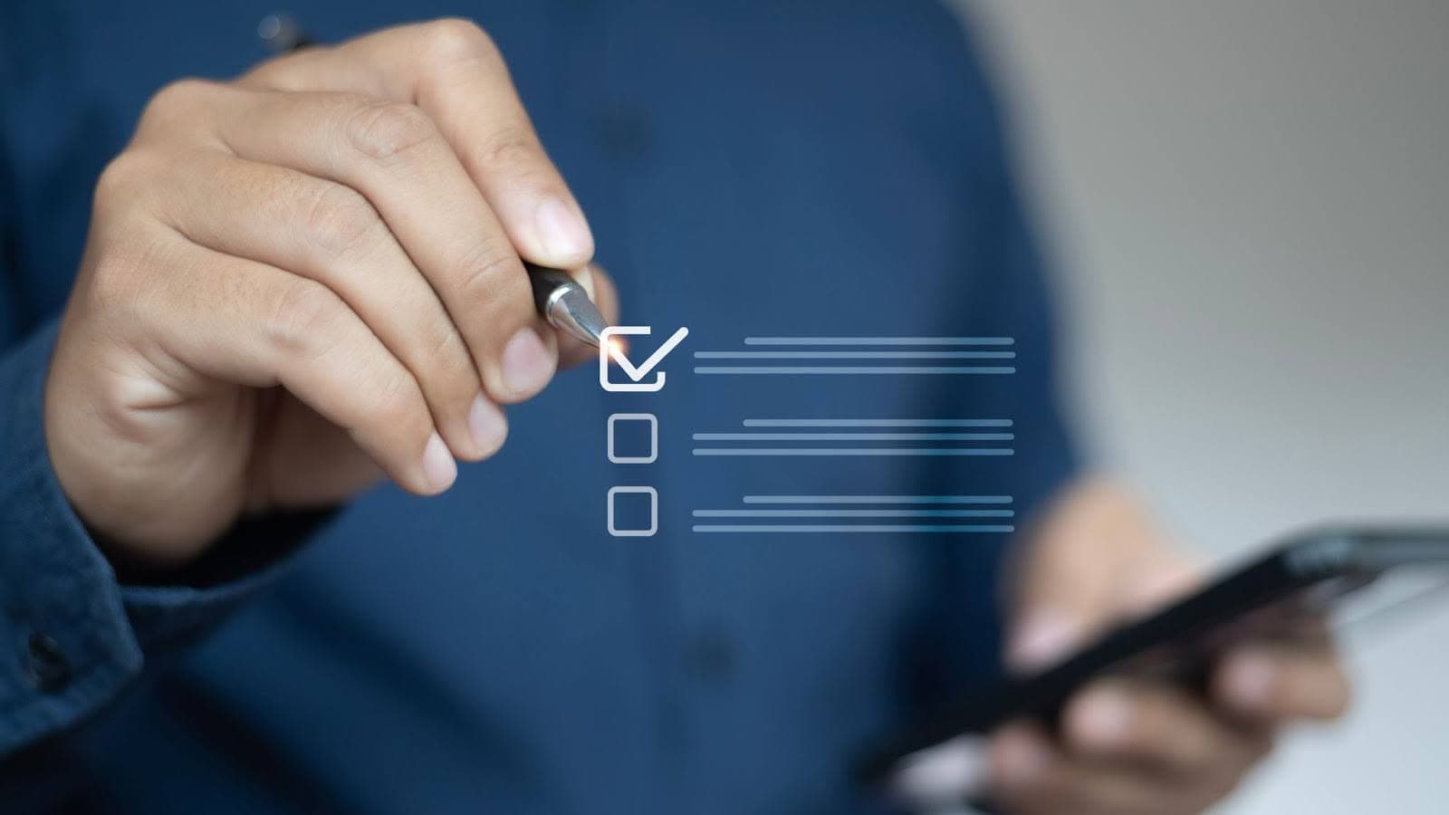 man ticking a box for a poll using a phone